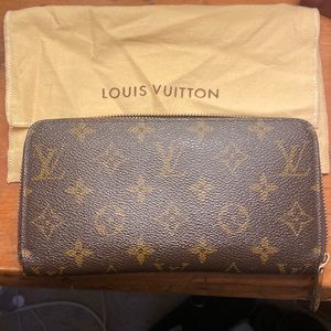 Louis Vuitton zip wallet. Used light ware at corners.